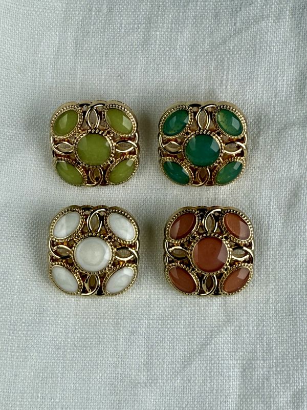 Elegante emaljerte knapper